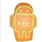 Piernik reklamowy w kształcie robota z wylukrowanym na zielono logo Androida